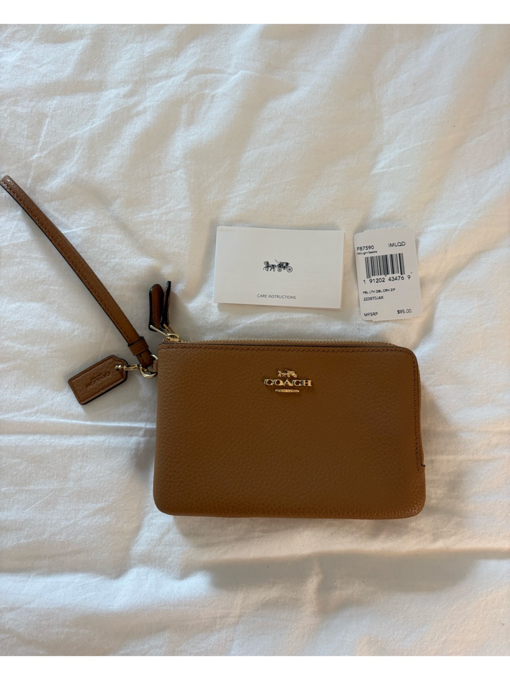 Coach Brown Leather Wristlet with Gold Accent Tag